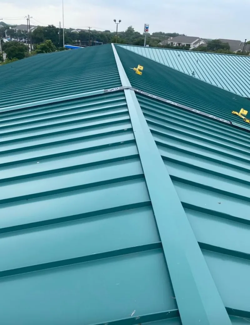 Green commercial metal roof ridge and valley for Metal Roof Repair in Norwood